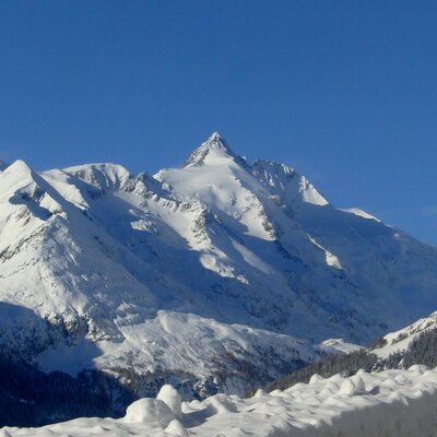 Snow-covered mountains of the Hohe Tauern National Park, part of the winter landscape near the Farm House.