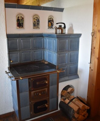 wooden stove combined with a tiled stove