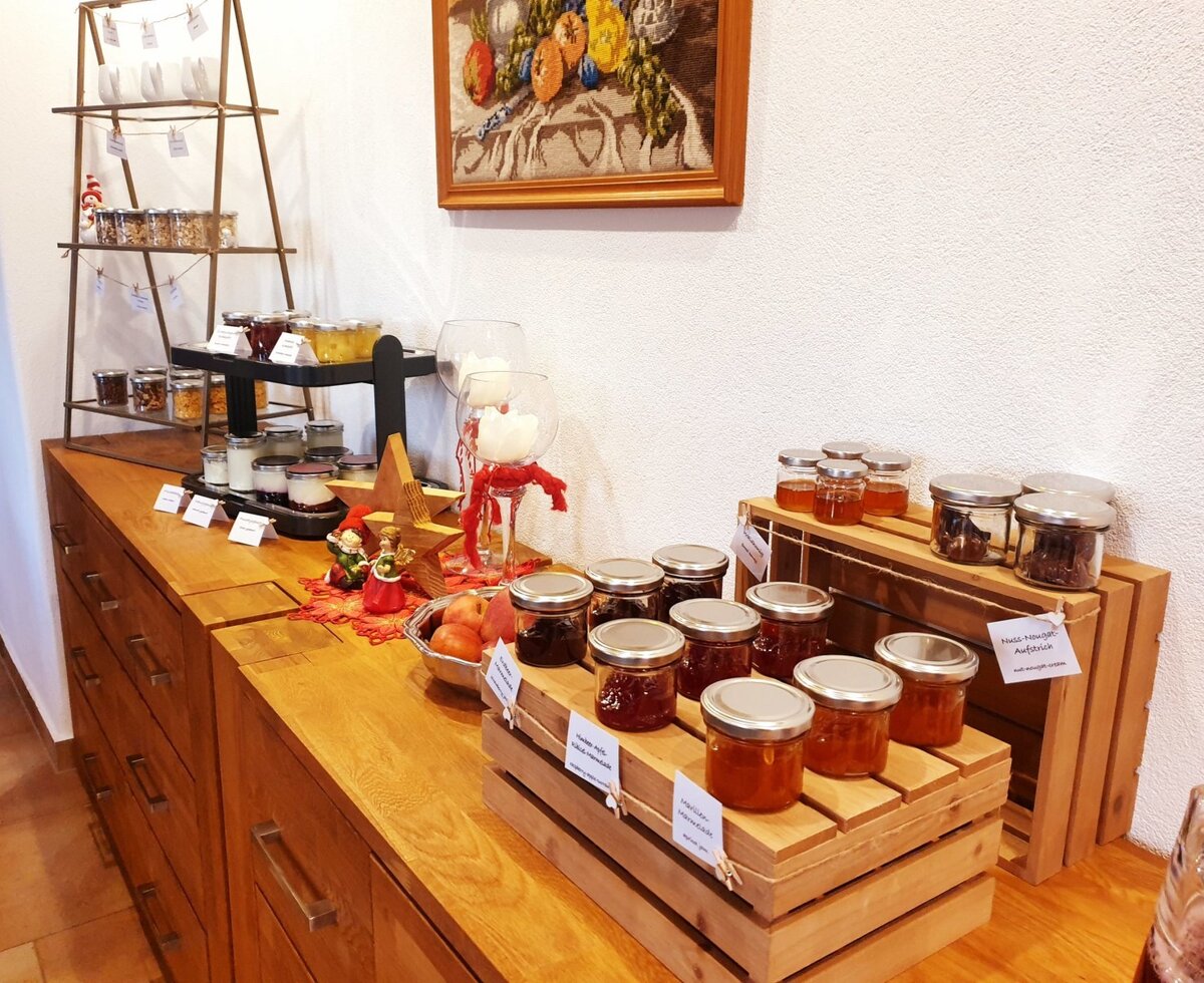 Breakfast buffet in the main building - with muesli, homemade jams and juices, honey, yogurt, fruit,...
