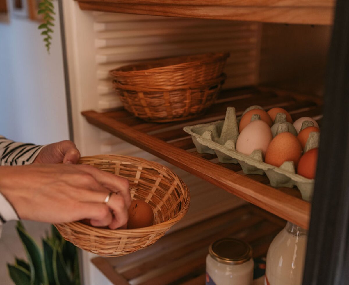 Fresh eggs in a basket, stored in the kitchen of the farmhouse apartment.