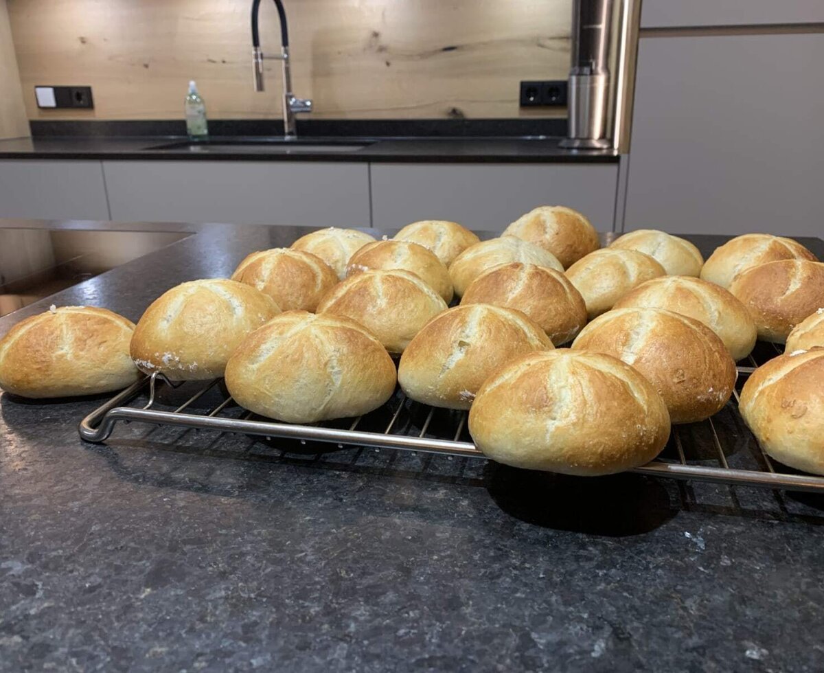 Freshly baked, golden-brown rolls.