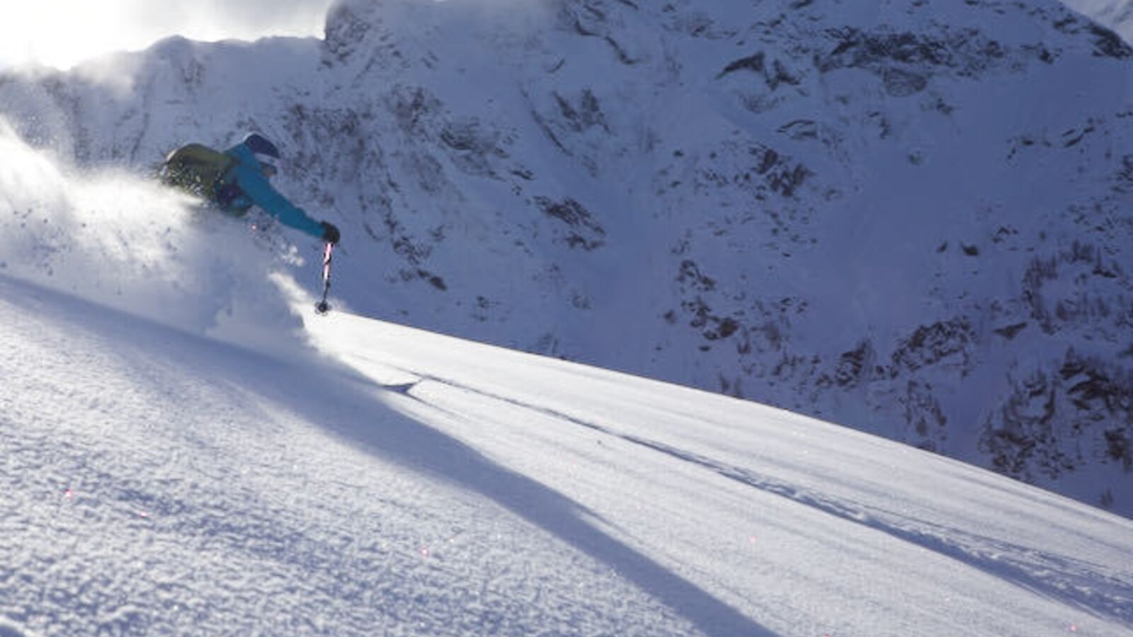 Skiing on a snowy mountain, one of the winter activities offered for guests staying at the farmhouse.
