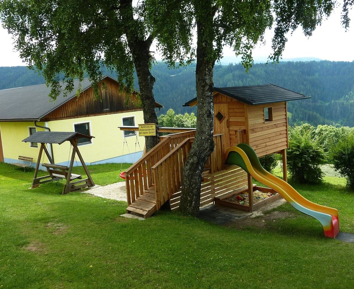 Playground with playhouse and slide
