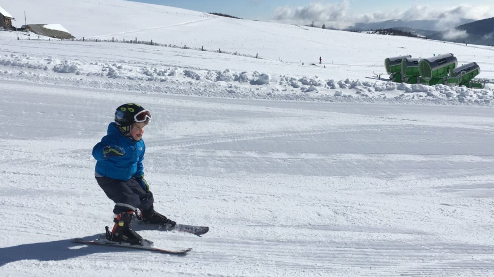 Children can enjoy skiing on groomed slopes in the snowy landscape near the Farm House.