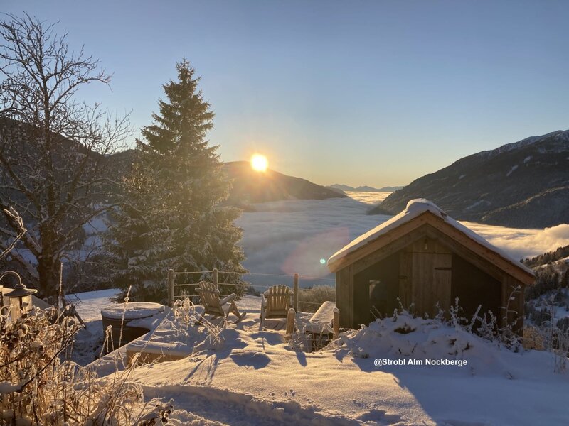 Sunrise in Winter above a see of fog in the valley@Strobl Alm Nockberge