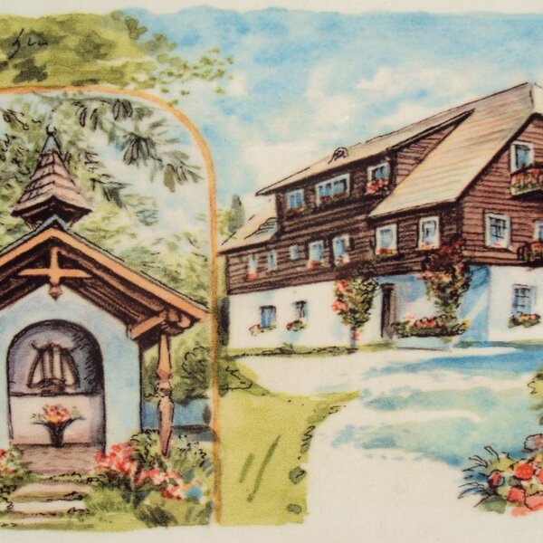 The farmhouse building with wooden balconies and window boxes, depicted next to a small traditional chapel.