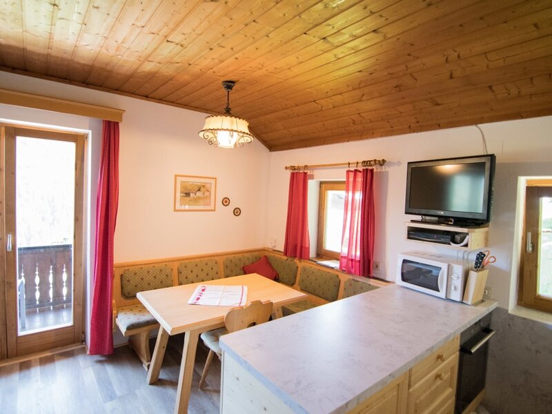 Dining nook and kitchen-diner in the holiday home at the edge of the forest