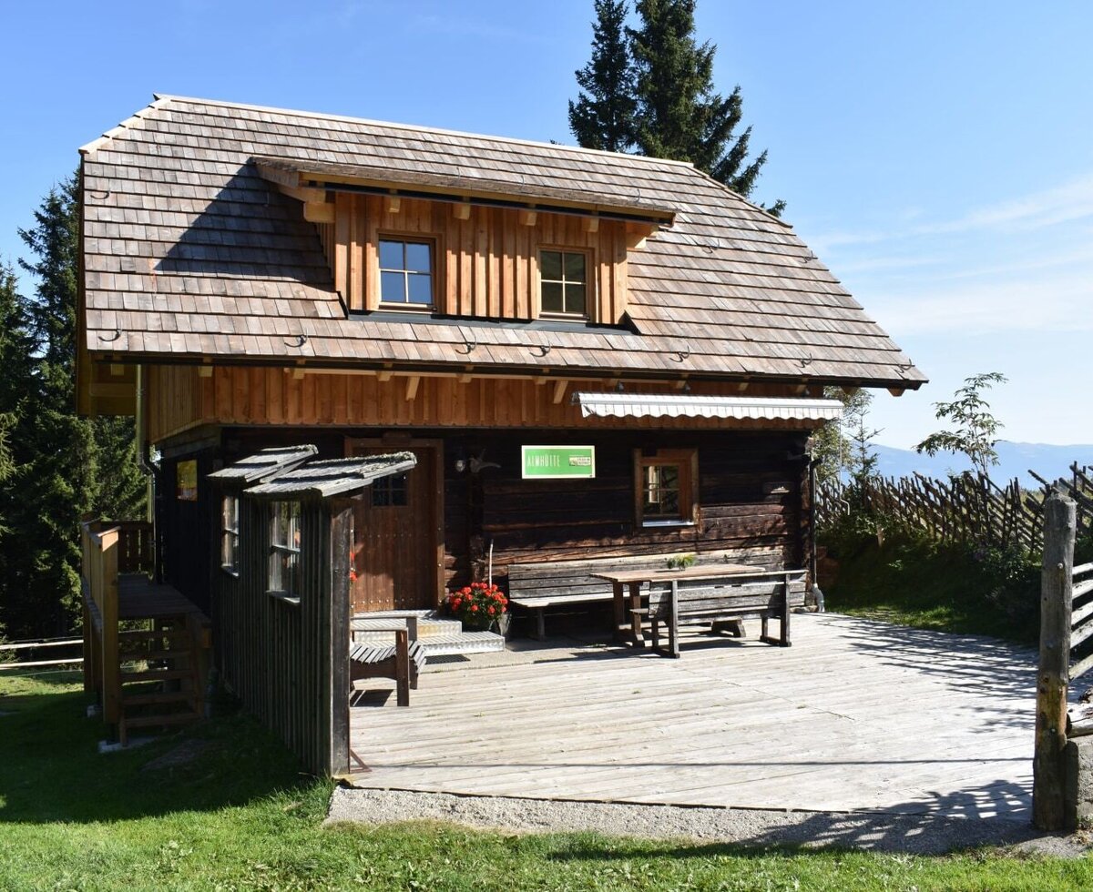 The sunny outdoor area of the hut - the upper floor was renovated in summer 2023.