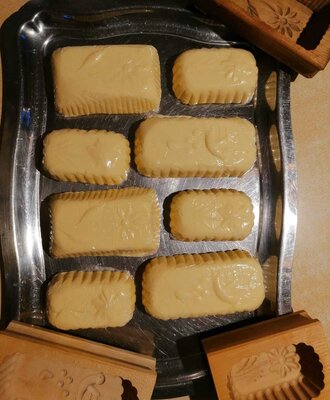 Molded butter blocks and traditional wooden butter molds displayed at the Farm House.