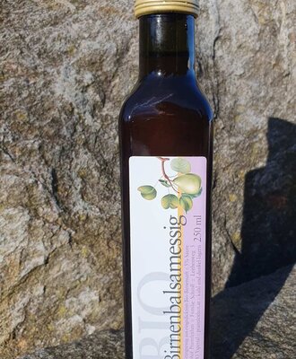 Organic pear balsamic vinegar in a 250 ml bottle, a product of the farm.
