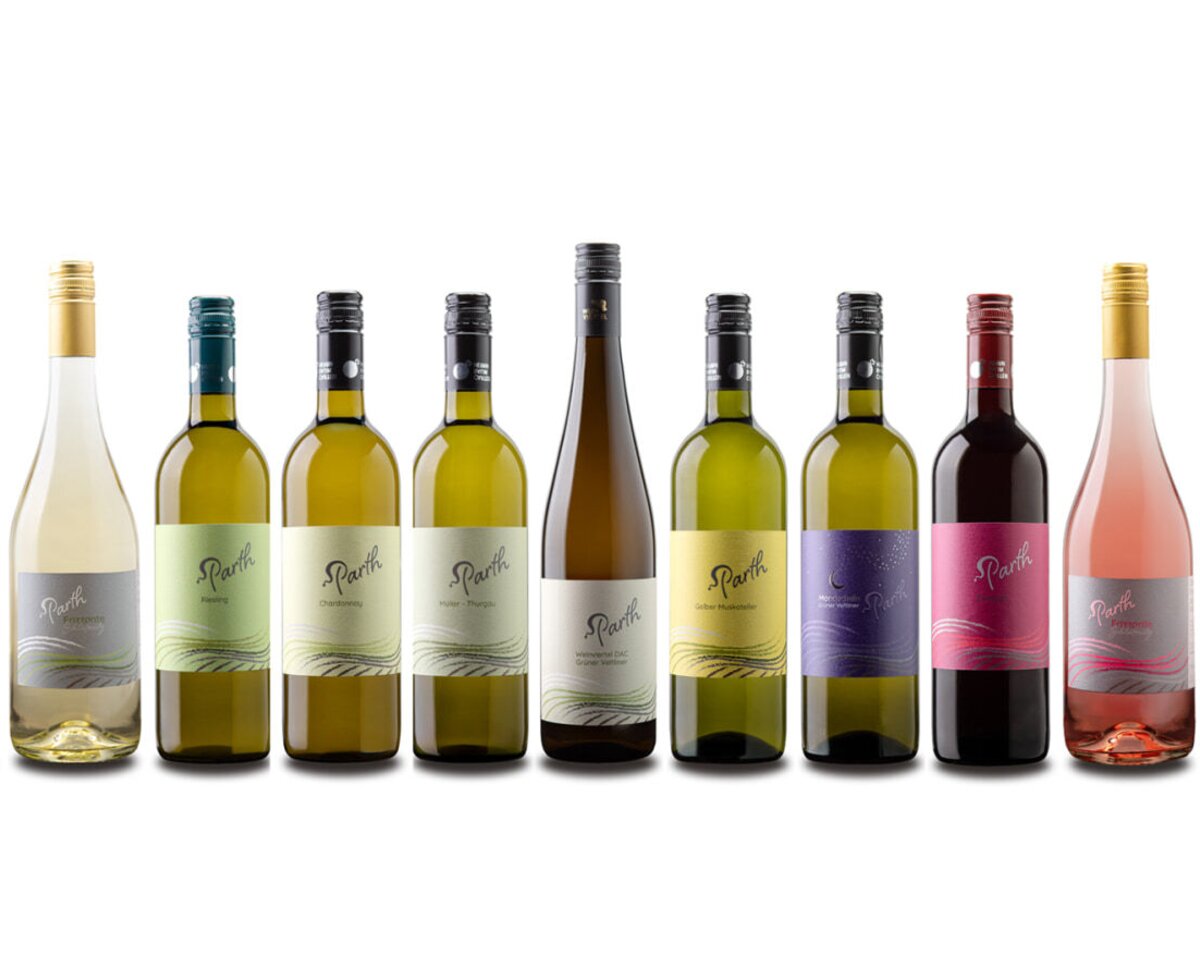 A selection of white, rosé, and red wine bottles, available in the farmhouse's wine tavern.