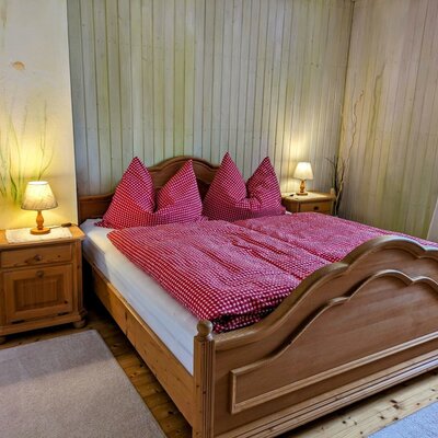 Bedroom in the farmhouse with a double bed.