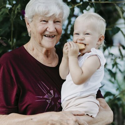 A grandmother and baby, showcasing the family-friendly environment of the farmhouse.