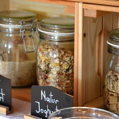 Muesli and cereals in jars as part of the farmhouse breakfast at the Bauernhof.