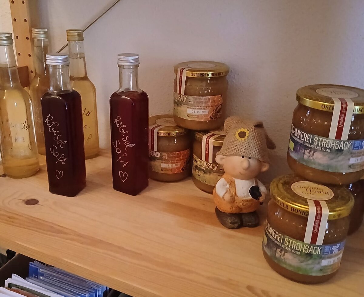 Local products offered at the farmhouse, including currant juice and honey from Strohsack Apiary.