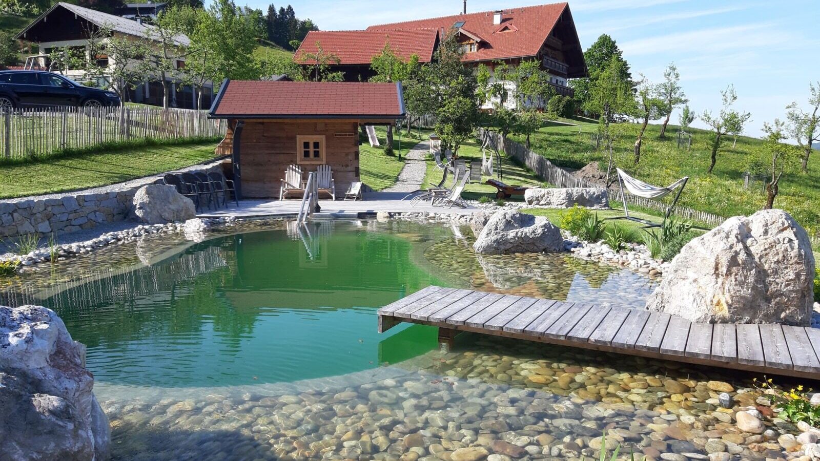 Swimming pond with house