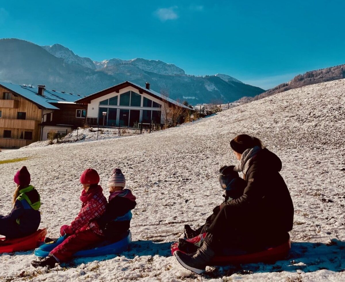 Sledding on the home meadow