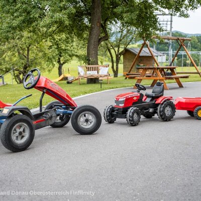 Children's pedal go-kart and tractor with trailer
