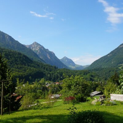 View from the Farm House grounds of the surrounding mountains, forested valley, and a nearby village.