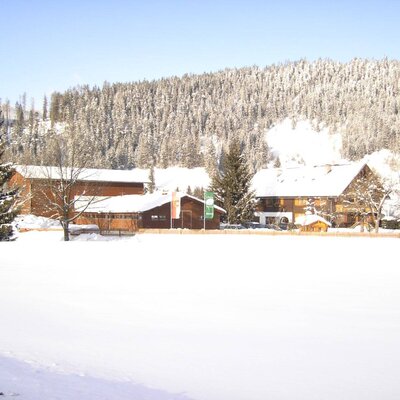 Our Arnoldgut farm in the middle of a winter landscape deep in snow