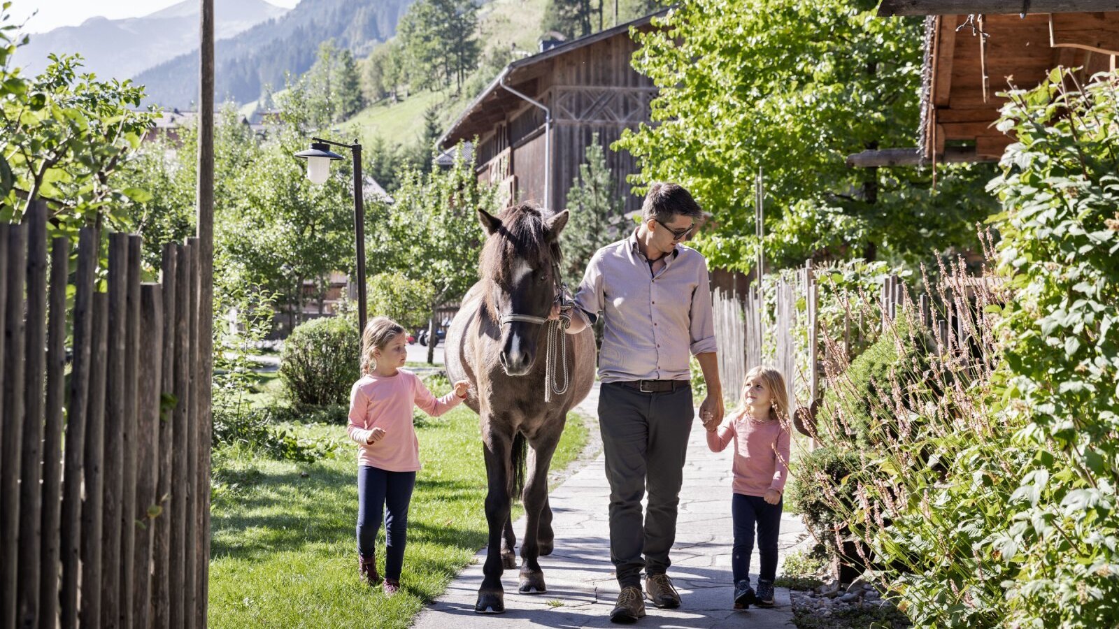 Guests at the Farm House can enjoy activities like walking a horse with children.