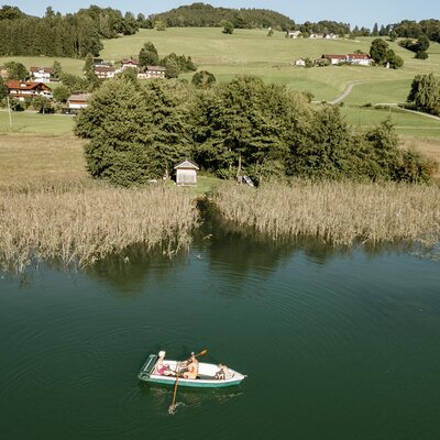 The Bed and Breakfast's private bathing area on Lake Irrsee with its own boathouse and rowing boat, perfect for lake excursions.