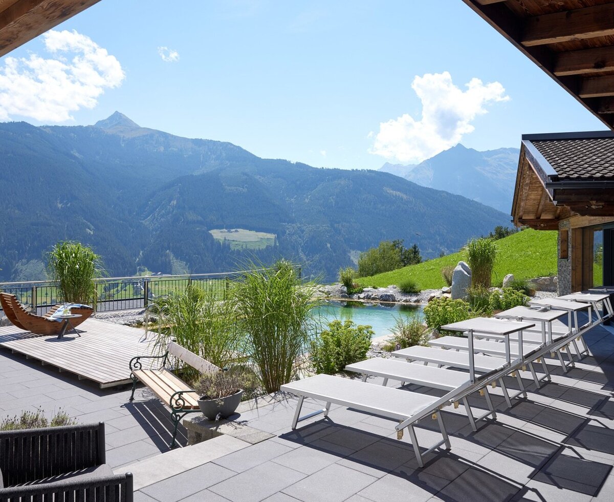 The Farm House features a patio with a swimming pond, sun loungers, and mountain views.