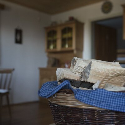 A basket with firewood for heating in the kitchen. cMiriamRaneburger
