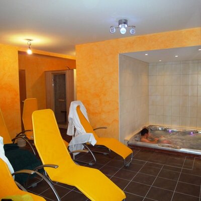 The Farm House features an indoor spa area with a hot tub, loungers, and a sauna.