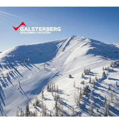 The Galsterberg ski area in Schladming-Dachstein with snow-covered slopes and ski lifts.