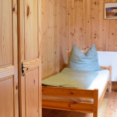 single bed in forrest view room