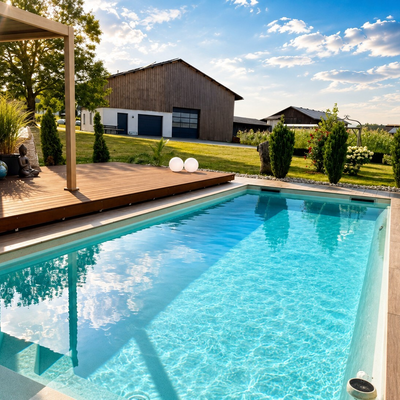 An inviting, crystal-clear outdoor pool on the farmhouse grounds, complete with a sunny wooden deck and scenic rural surroundings.