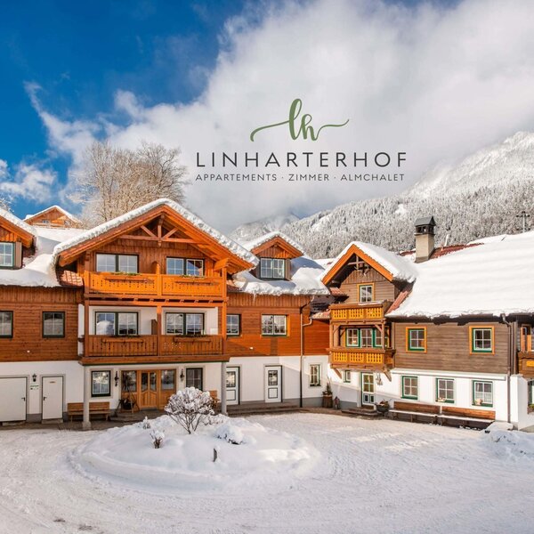 The Farm House exterior features traditional wooden architecture, balconies, and snow-covered roofs, set against a mountainous landscape.
