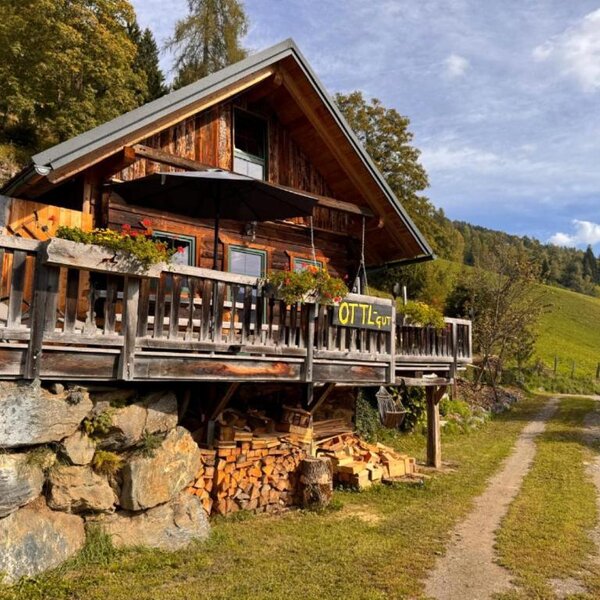 Ottls Hütte with an inviting terrace surrounded by idyllic nature.
