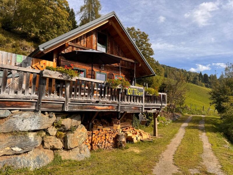 Ottls Hütte with an inviting terrace surrounded by idyllic nature.