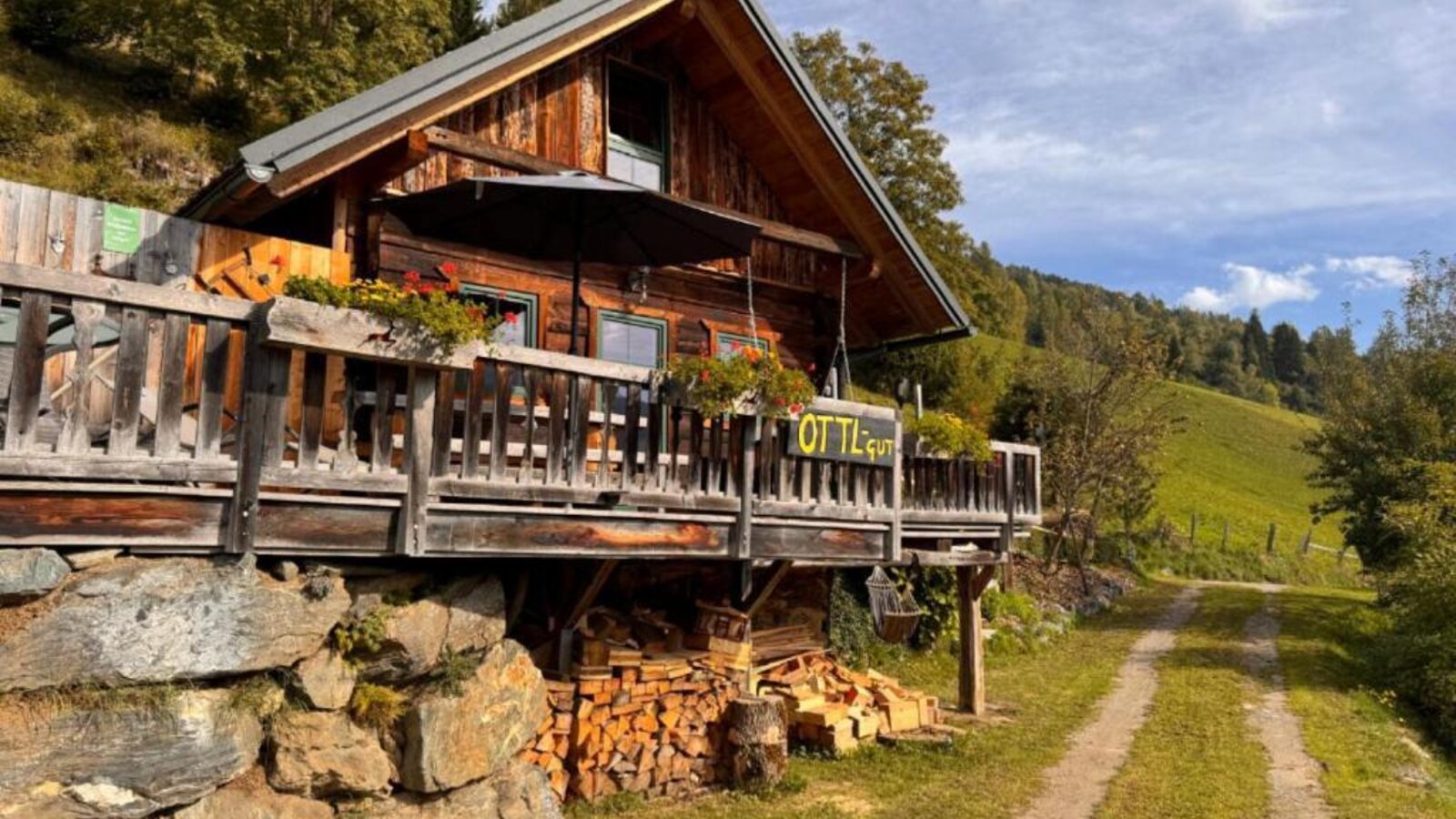 Ottls Hütte with an inviting terrace surrounded by idyllic nature.