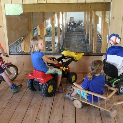 our popular play barn with a view into the cow shed