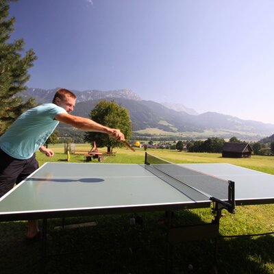 Guests can enjoy outdoor table tennis at the Farm House, with views of the surrounding mountains and countryside.