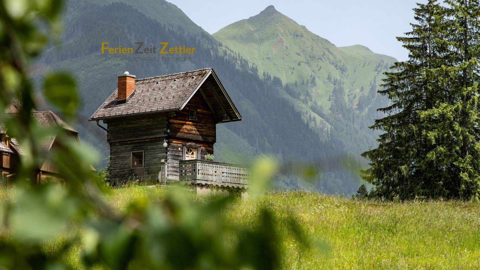 The Troadkasten on a meadow with mountains in the background.