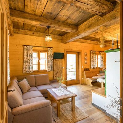 Living area of the Bed and Breakfast featuring an L-shaped sofa, wooden coffee table, and access to the terrace.