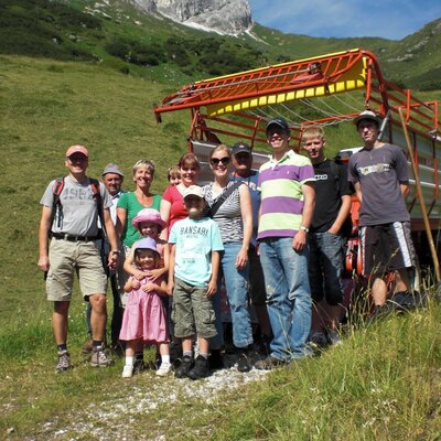 Guest excursion in summer: Together by tractor, we go to our alpine pasture in the heart of the Tyrolean mountains.