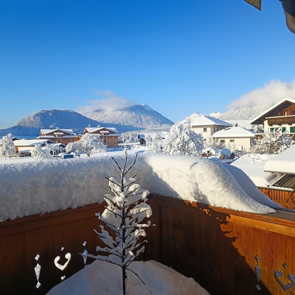 View of the snow-covered village and mountains from the Farm House's south-facing balcony.