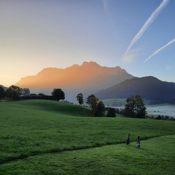 Scenic view from the apartments of the surrounding mountains bathed in the warm light of sunrise.