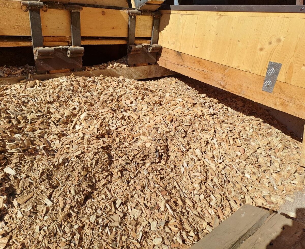 The wood chip storage is filled, for sustainable heating, organic farm Inntalblick