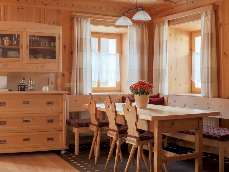 Traditional farmhouse living room with dining table