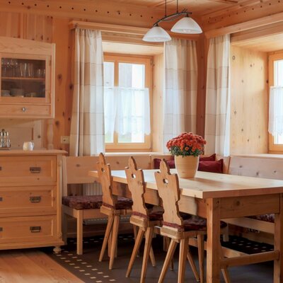 Traditional farmhouse living room with dining table
