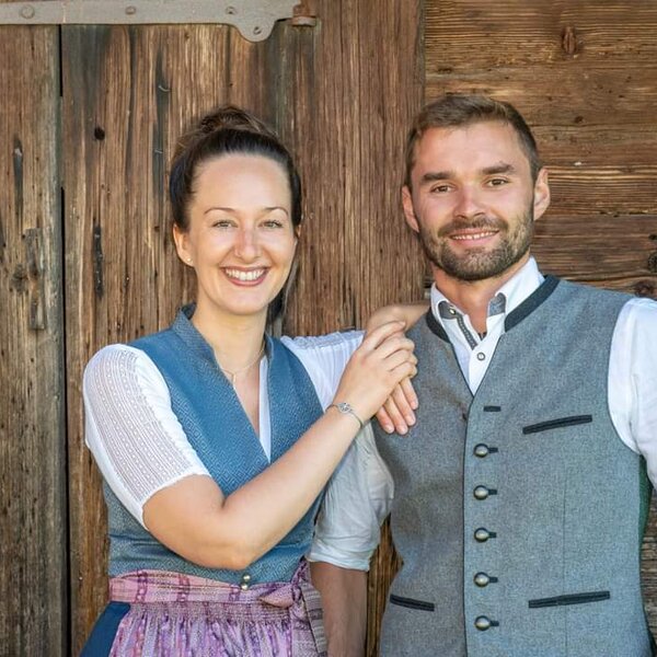 Christina and Jakob, the hosts of the farmhouse, welcoming guests.