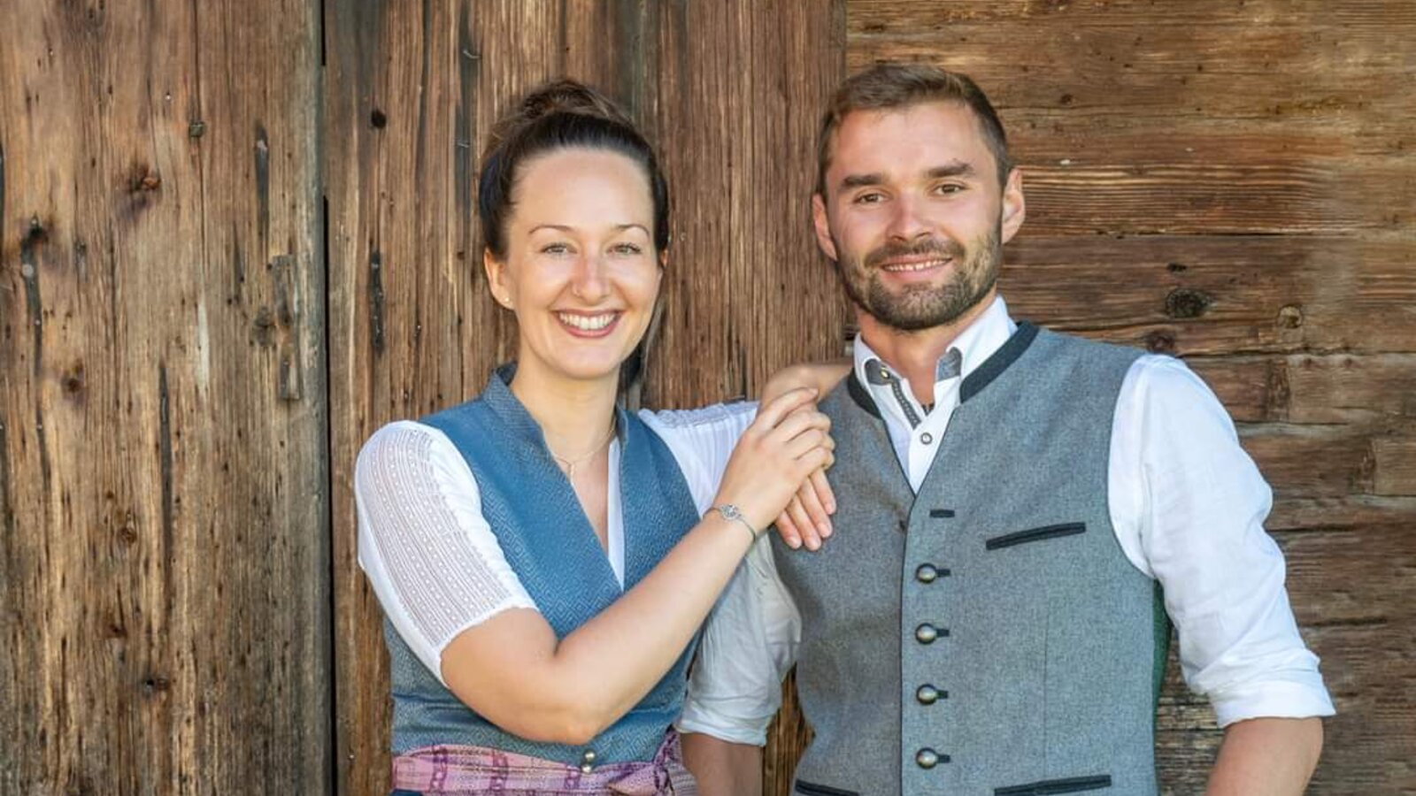 Christina and Jakob, the hosts of the farmhouse, welcoming guests.