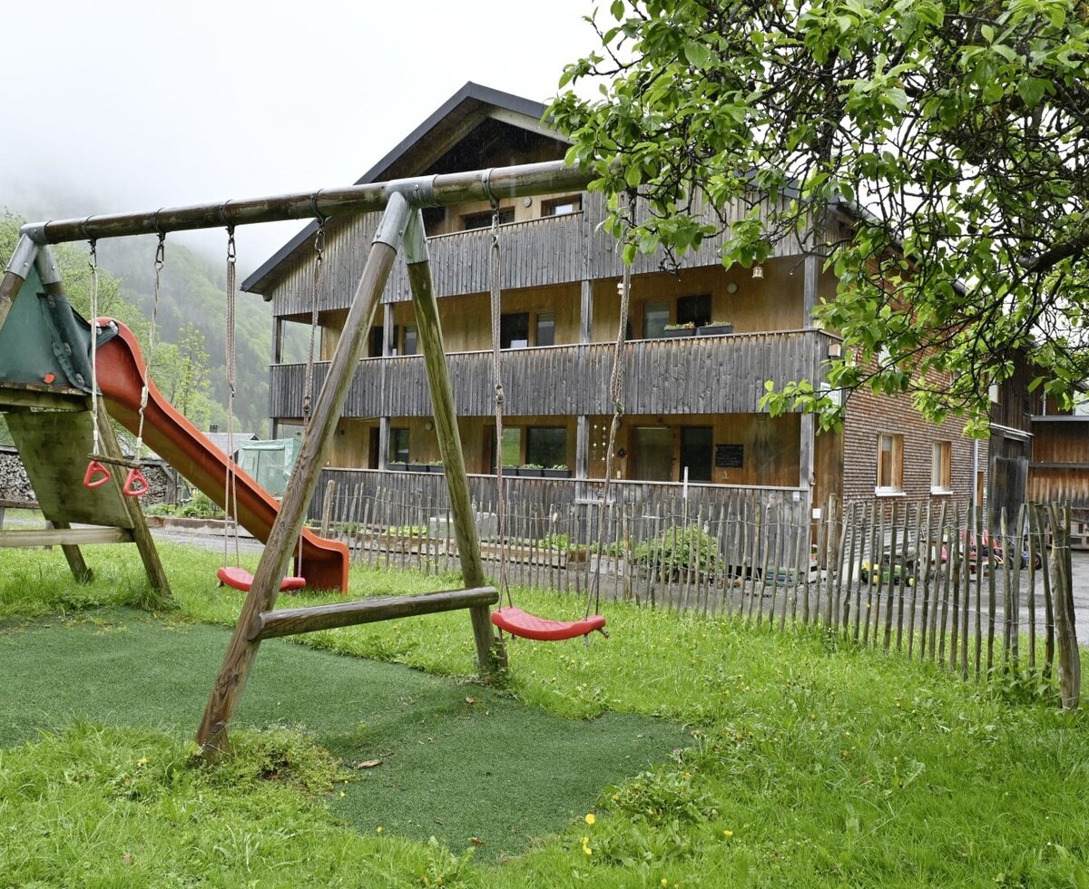 There are lots of places to swing, hide and play in our garden.
