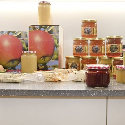 Products available directly at the farmhouse, including high mountain honey, eggs, cheese, and homemade preserves.